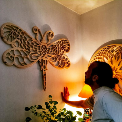 Handmade wooden art dragonfly mandala with custom design and unique pattern mounted on wall